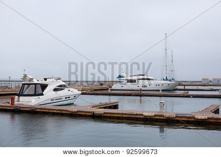 Luxury Yachts Parked In A Bay On The Sea