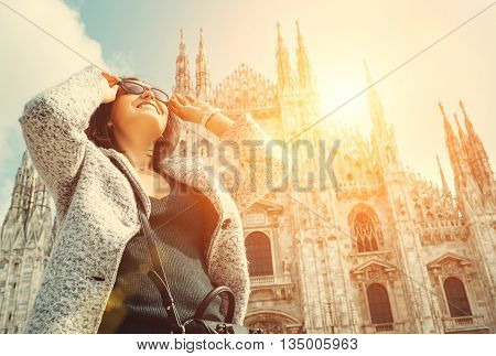 Woman in sun eye glasses stay near Doumo di Milano