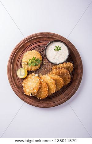 tasty sabudana vada or sabudana vade made up of Sago served with peanut chutney, a famous fasting recipe or snack from maharashtra, India