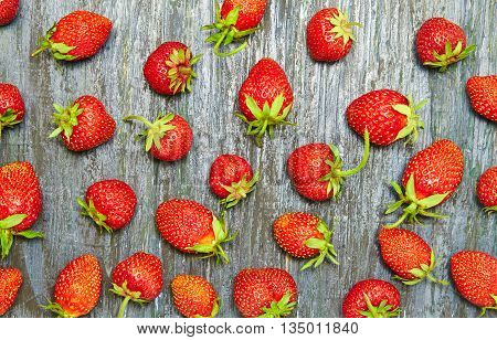 strawberry pattern on blue dark wooden background