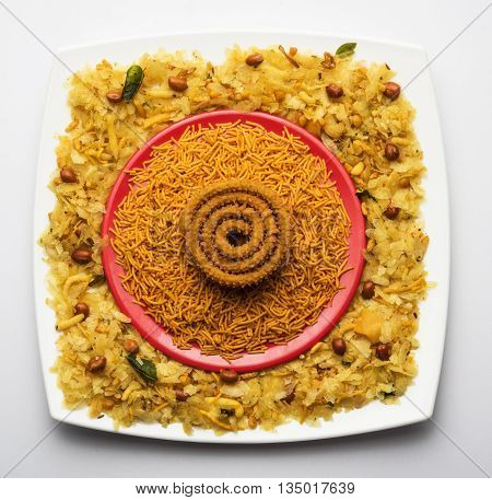 design created using diwali food or diwali snacks, chivda or chiwda, chakali or chakli, besan sev, front angle closeup