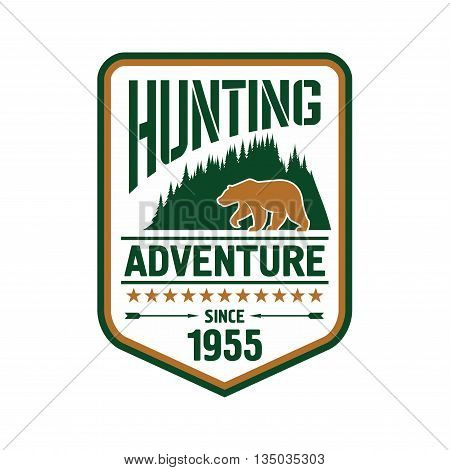 Hunting and outdoor adventure badge design with bear on the front of woody mountains supplemented by stars, arrows and foundation date