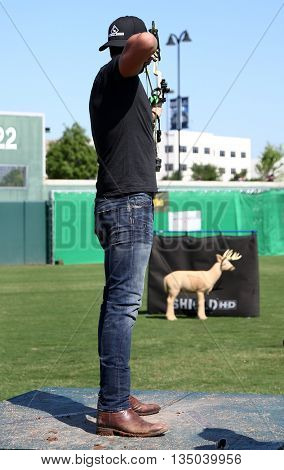 ARLINGTON, TX - APR 18: Recording artist Luke Bryan participates at the ACM & Cabela's Great Outdoor Archery Event at the Texas Rangers Youth on April 18, 2015.