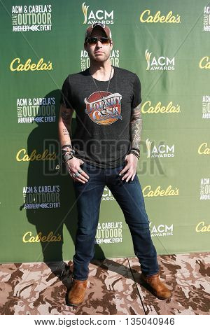 ARLINGTON, TX - APR 18: Singer Austin Webb attends the ACM & Cabela'??s Great Outdoor Archery Event at the 50th Academy Of Country Music Awards at the Texas Rangers Youth Ballpark on April 18, 2015.