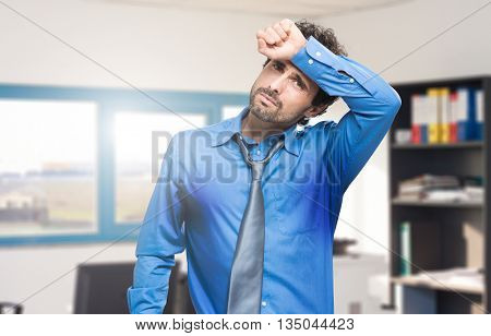  Sweating businessman due to hot climate