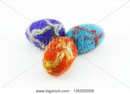 Easter eggs made of wool handmade on a white background