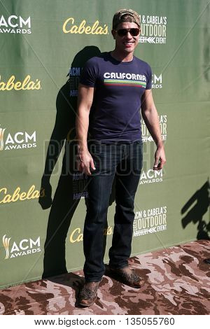 ARLINGTON, TX - APR 18: Dustin Lynch attends the ACM & Cabela'??s Great Outdoor Archery Event during the 50th Academy Of Country Music Awards at the Texas Rangers Youth Ballpark on April 18, 2015.