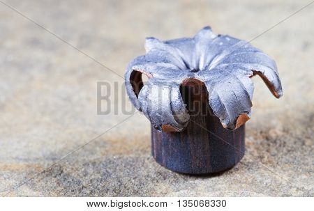 Expanded hollow point on a copper plated bullet after testing