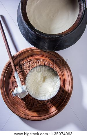 Herbal juice of green momodica in a glass with sliced vegetables, karela juice or bitter gourd juice