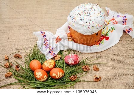 Homemade Easter cake and painted eggs on the table