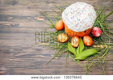 Homemade Easter cake and painted eggs on the table