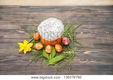 Homemade Easter cake and painted eggs on the table