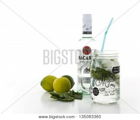 SWINDON UK - JUNE 20 2016: Classic Mojito cocktail in a Kilner Mason Jar with a bottle of Bacardi isolated on a white background