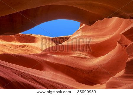 rock waves up to the blue sky antelope canyon