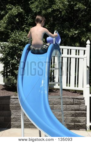 Boy On Slide Backwards