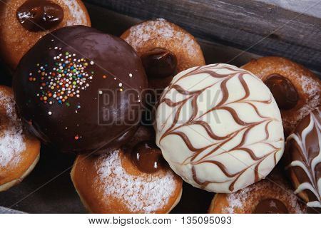 traditional jewish holiday chanuka donuts in retro vintage tray isolated on white background