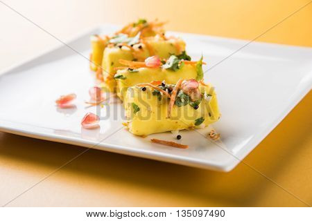khandvi is a gujarati snack from India which is made with gram flour and curds tempered with sesame seeds and mustard seeds also known as Surali chya Vadya/Stuffed Khandvi, selective focus
