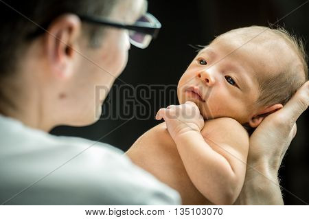 Happy Father Holding With Love His New Born Son