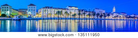 Waterfront cityscape panorama of touristic town of Split in blue hour, Croatia.