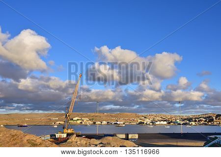 LUDERITZ NAMIBIA - JAN 26 2016: Luderitz port at sunset. Luderitz is a harbour town in southwest Namibia lying on one of the least hospitable coasts in Africa