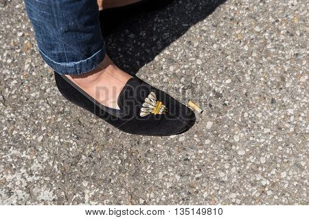 MILAN ITALY - JUNE 18: Detail of shoes outside Marni fashion show building for Milan Men's Fashion Week on JUNE 18 2016 in Milan.