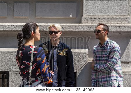 MILAN ITALY - JUNE 18: Fashionable people gather outside Marni fashion show building for Milan Men's Fashion Week on JUNE 18 2016 in Milan.