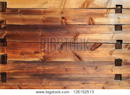 Texture of old wooden wall with mortise and tenon joint