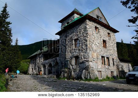 Kuznice Poland - June 14 2016: Murowaniec mountain hostel in Tatra mountains in Poland. Unidentified people visible.
