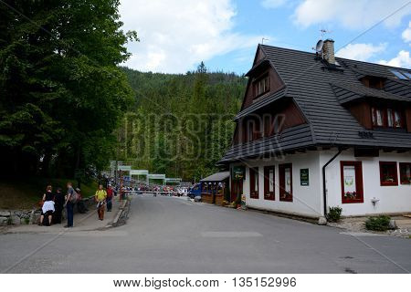 Kuznice Poland - June 15 2016: Street in Kuznice nearby Zakopane in Poland. Unidentified people visible.