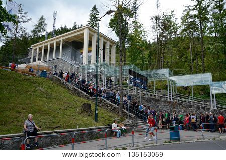 Kuznice Poland - June 15 2016: Long queue at Kasprowy cable car station in Kuznice nearby zakopane in Poland. Unidentified people visible.