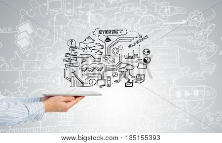 Businessman hand demostrating business strategy plan on tablet screen