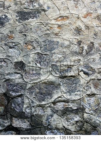 Grey stone texture background closeup. Stonework cement works
