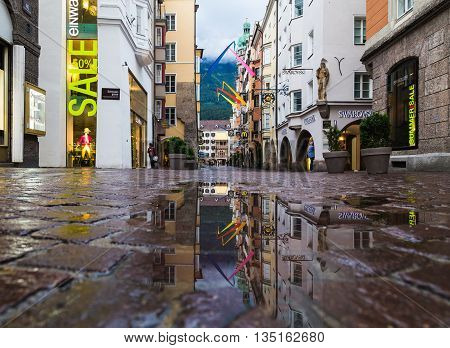 INNSBRUCK AUSTRIA - 18TH JUNE 2016: A view along Herzog Friedrich Strasse towards the Golden Roof building. People can be seen.