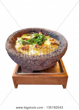 Molcajete isolated over white background. Molcajete is a traditional Mexican stone tool and it's used for preparation and serving of different kinds of food.