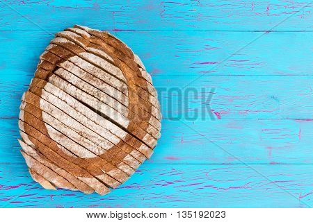Homemade Bread Loaf On Crackled Blue Table Surface