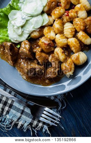 Italian Potato Dumplings With Stew And Cucumber Salad
