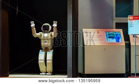 TOKYO JAPAN - NOVEMBER 27 2015: Asimo the humanoid robot created by Honda is presented at Miraikan The National Museum of Emerging Science and Innovation in Odaiba area