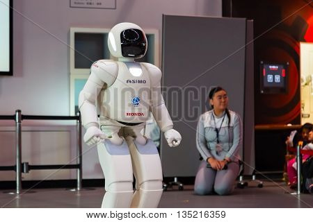 TOKYO JAPAN - NOVEMBER 27 2015: Asimo the humanoid robot created by Honda is presented at Miraikan The National Museum of Emerging Science and Innovation in Odaiba area