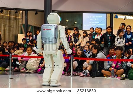TOKYO JAPAN - NOVEMBER 27 2015: Asimo the humanoid robot created by Honda is presented at Miraikan The National Museum of Emerging Science and Innovation in Odaiba area