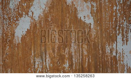 the paint has worn off with a wooden fence and became ugly
