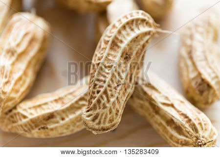 Close up texture of peanut with wooded backgournd
