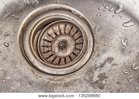 detail shot of a old dirty sink with scrubber inside.old sinkdrop in sink