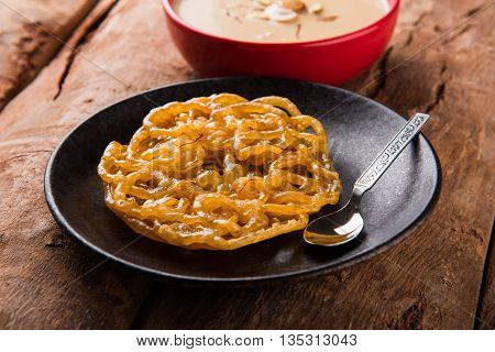 jalebi with rabdi made from condensing milk, famous dessert sweet from India