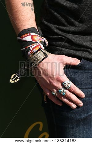 ARLINGTON, TX - APR 18: Jewelry worn by recording artist Austin Webb at the ACM & Cabela'??s Great Outdoor Archery Event at the Texas Rangers Youth Ballpark on April 18, 2015.