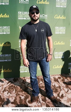 ARLINGTON, TX - APR 18: Tyler Farr attends the ACM & Cabela'??s Great Outdoor Archery Event during the 50th Academy Of Country Music Awards at the Texas Rangers Youth Ballpark on April 18, 2015.