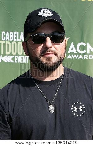 ARLINGTON, TX - APR 18: Tyler Farr attends the ACM & Cabela'??s Great Outdoor Archery Event during the 50th Academy Of Country Music Awards at the Texas Rangers Youth Ballpark on April 18, 2015.