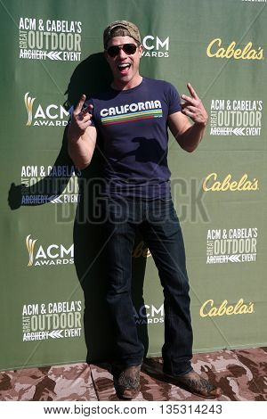 ARLINGTON, TX - APR 18: Dustin Lynch attends the ACM & Cabela'??s Great Outdoor Archery Event during the 50th Academy Of Country Music Awards at the Texas Rangers Youth Ballpark on April 18, 2015.
