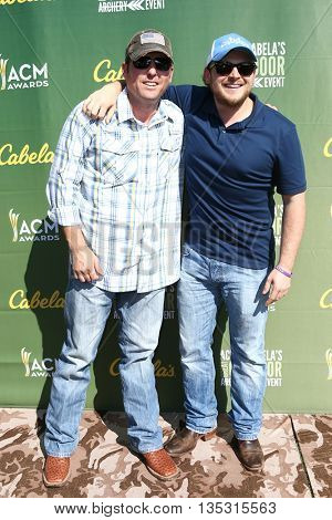 ARLINGTON, TX - APR 18: Recording artists Casey Donahew (L) and Josh Abbott attend the ACM & Cabela'??s Great Outdoor Archery Event at the Texas Rangers Youth Ballpark on April 18, 2015.