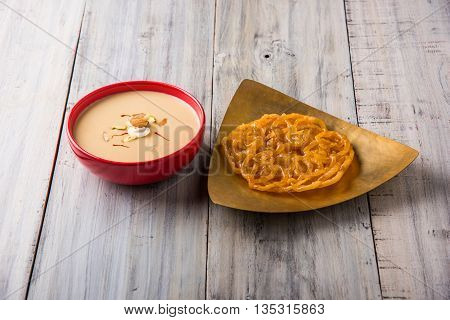 jalebi or imarati with rabdi made from condensing milk, famous dessert sweet from India