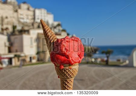 Italian Strawberry ice cream on a background of Sperlonga